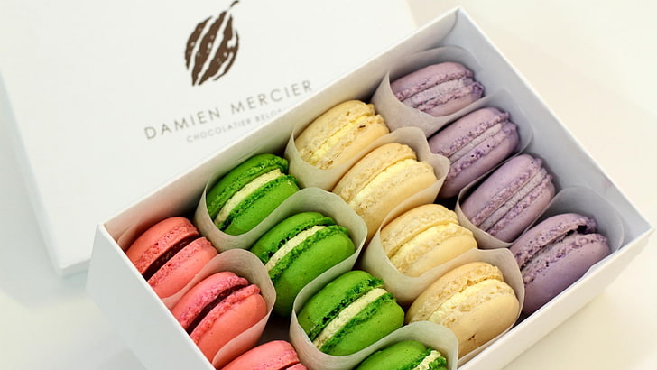 pink, green, yellow, and purple Damien Mercier macaroons with box