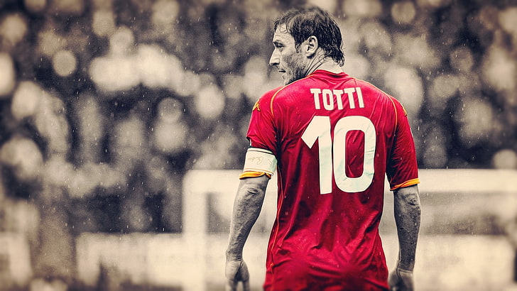 selective color photography of Totti standing near goal net, soccer