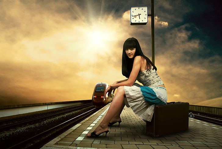 women's grey strapless dress, girl, station, train station, suitcase