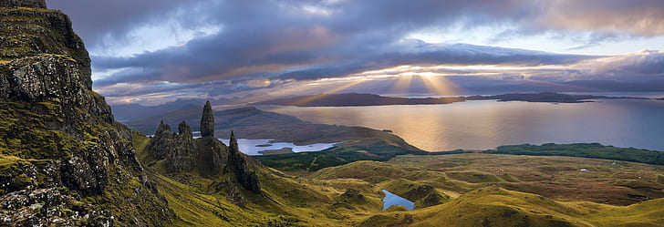 sunrise scotland island sunbeams sun rays sea bay mountain clouds panoramas old man of storr nature landscape grass skye uk