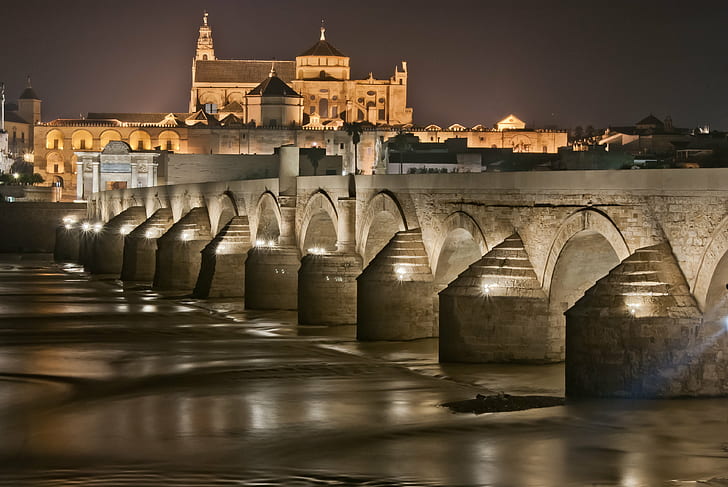 photo of concrete building near dock during night time, andalucia, andalucia