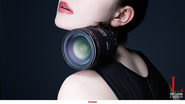 black Canon zoom lens, camera, commercial, one person, studio shot