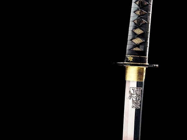 black handled katana, sword, black background, copy space, studio shot