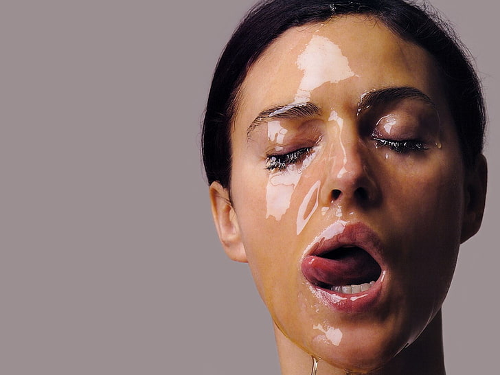 woman's face, Monica Bellucci, actress, licking lips, honey, closed eyes