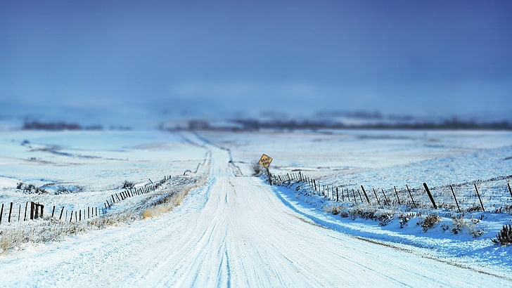 dirt road covered by snow, tilt shift, winter, signs, fence, landscape