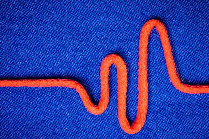 orange rope on top of blue textile, orange, blue  impulse, macro