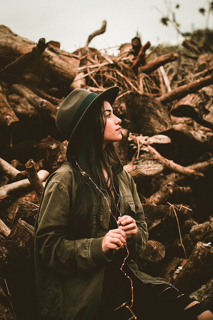 women outdoors, looking into the distance, wood, one person