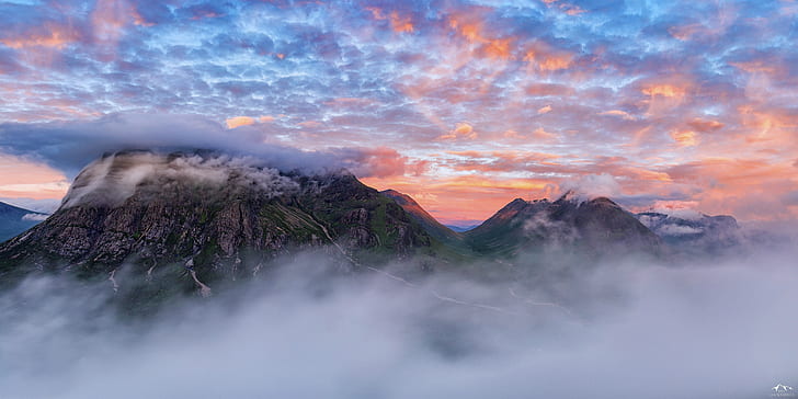 time lapse and HDR photography of mountain peak covered with clouds and fogs
