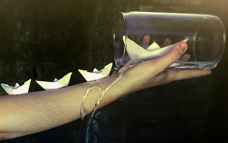 water, glasses, paper boats, human hand, human body part, holding