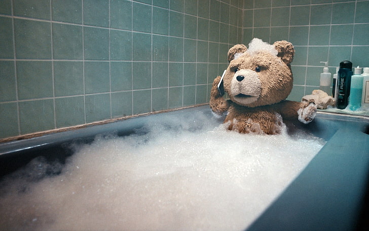 Ted screenshot, Ted on bath tub holding smartphone movie scene