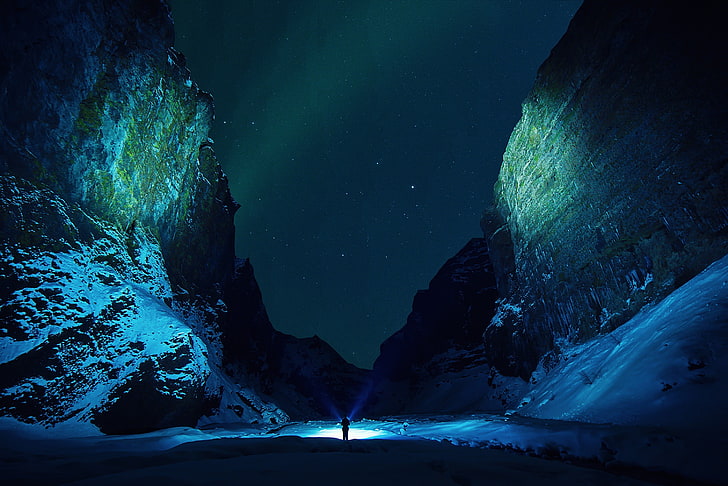 person standing holding light between hills, nature, mountains, HD wallpaper