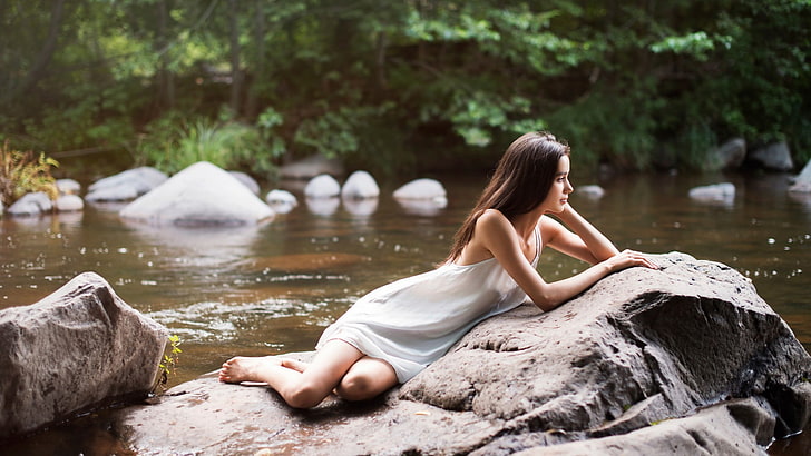 women's white sleeveless dress, rock, river, barefoot, white dress