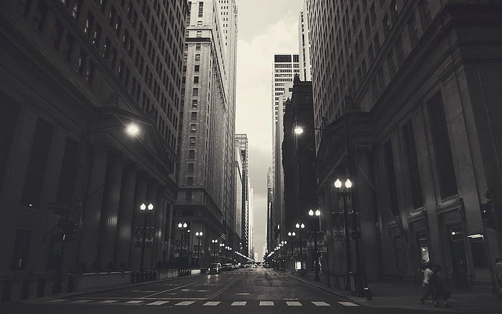 grayscale picture of city buildings, grayscale photography of road in between buildings