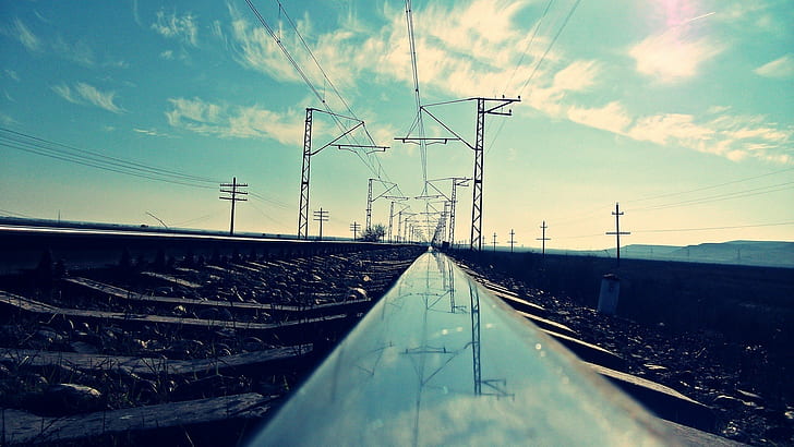 reflection  worms eye view  railway  filter  sky  power lines  utility pole  landscape  clouds
