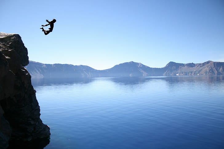 person jump off in a cliff photography, cliff jumping, crater lake  oregon