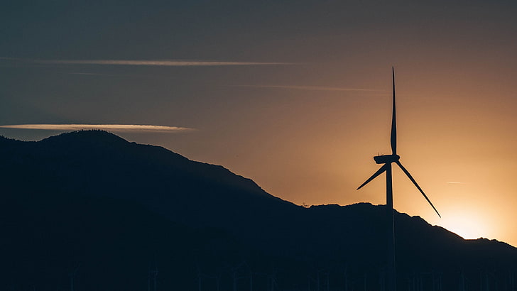 silhouette of wind mill near mountgain during golden hour, photography
