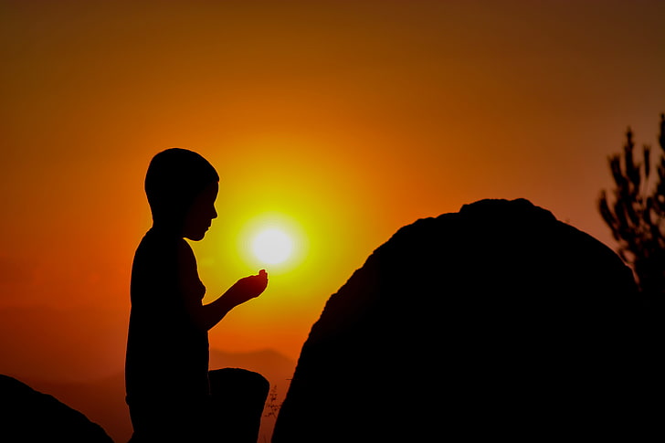 silhouette photo of kneeling boy, child, prayer, sunset, nature