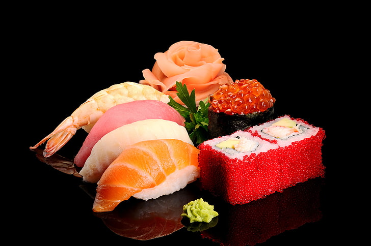assorted sushi, greens, fish, figure, black background, caviar