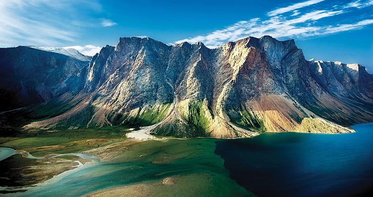 aerial view of mountain beside body of water, mountains, clouds