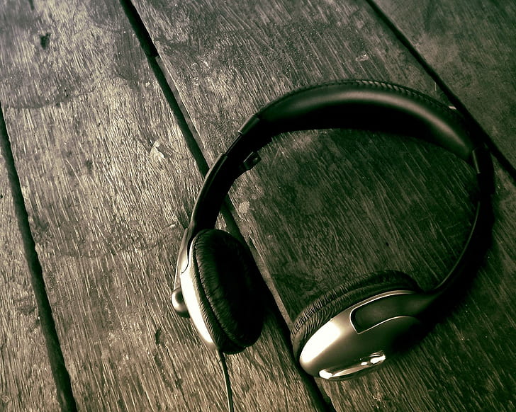headphones, wooden surface