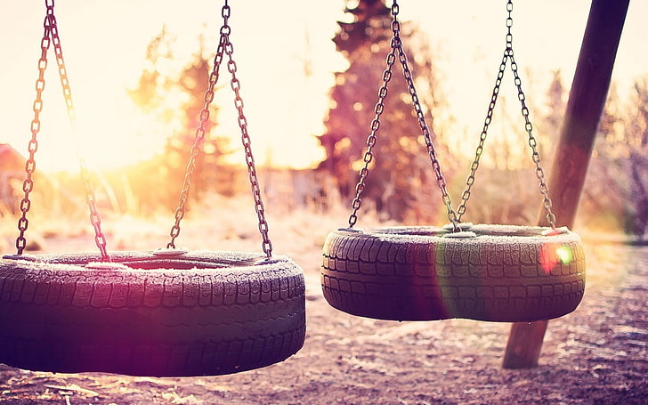 tires, swings, chains, sunlight, lens flare, filter, focus on foreground