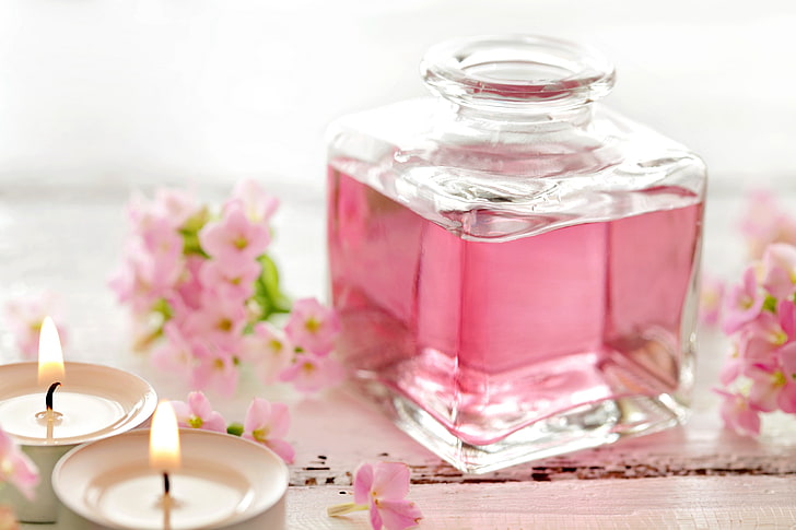 clear glass bottle and two tealight candles, pink, flowers, Spa