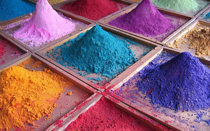 Colorful powder, blue, purple, and yellow powders, photography