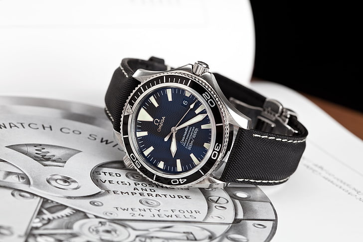 round black Omega analog watch with black leather band, Seamaster