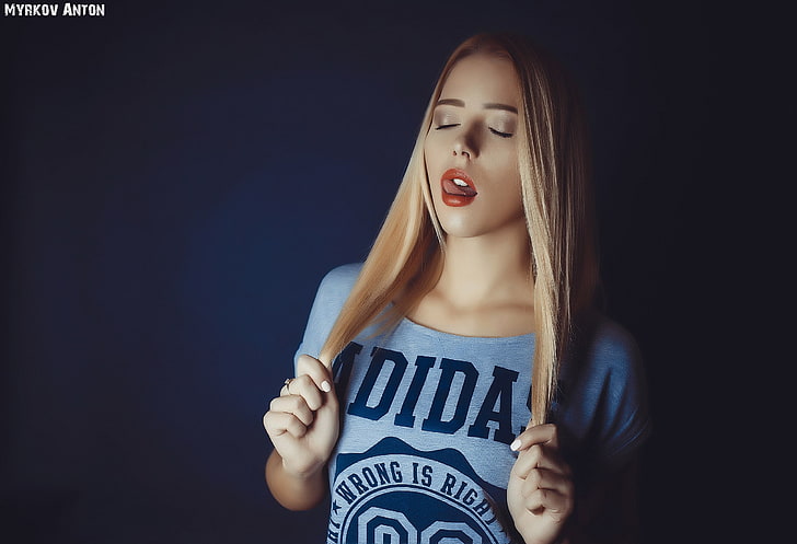 women's blue adidas scoop-neck shirt, blonde, closed eyes, simple background