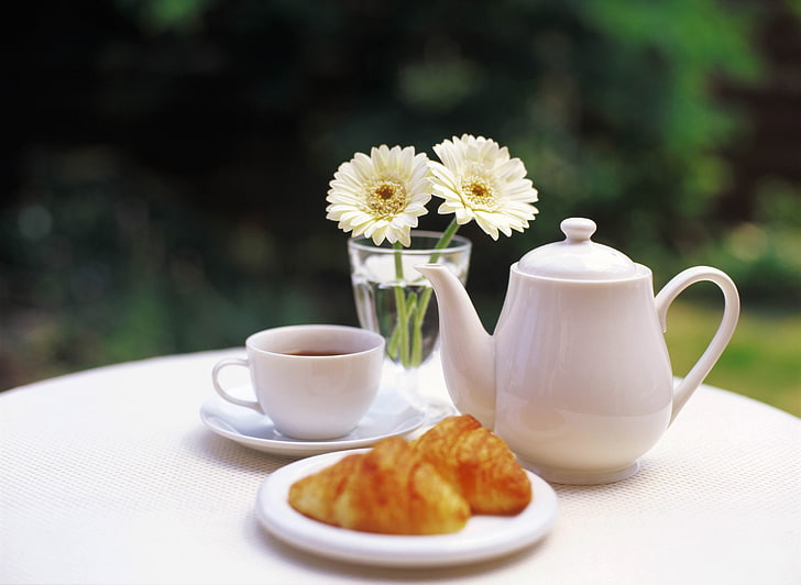 white ceramic tea pot, table, garden, tea leaves, flowers, cup