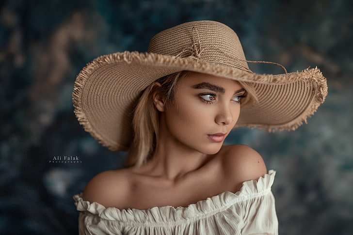 women's white off-shoulder top, woman wearing white off-shoulder dress and brown hat
