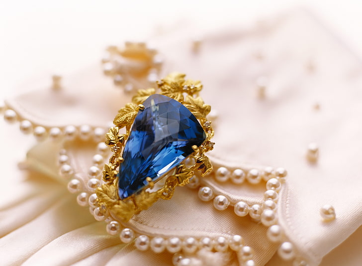 gold-colored ring with blue gemstone, decoration, pearls, jewelry