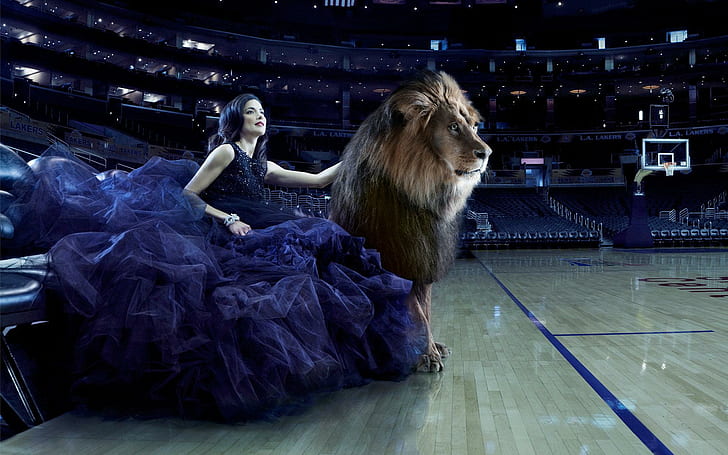 Girl and a lion on the court, women's blue sleeveless long gown