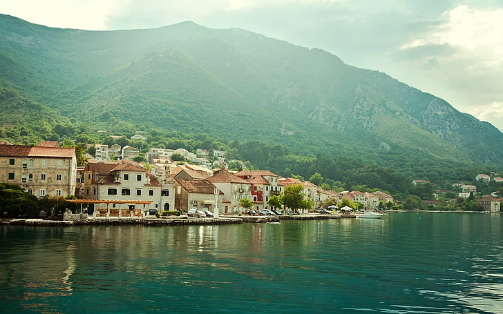 houses near body of water, town, mountains, architecture, building exterior