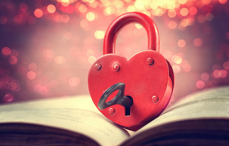 heart-shape red metal padlock with gray key, background, castle