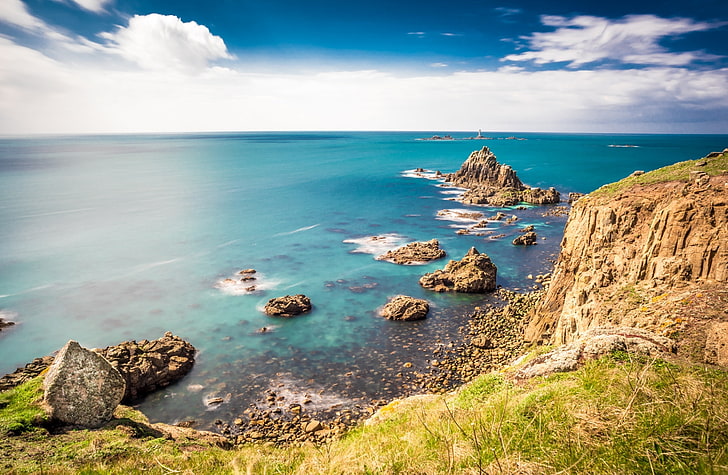 Rocky shorelines at Lands End, Cornwall,..., ocean water and rock formations