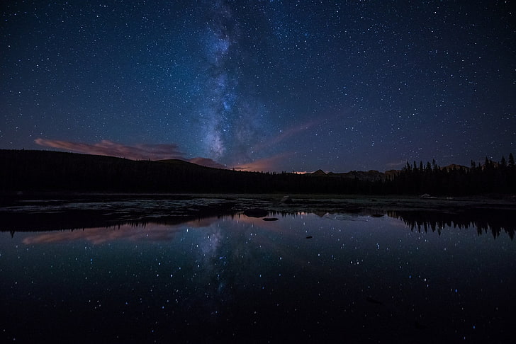 body of water under milkway, stars, space, planet, galaxy, mountains
