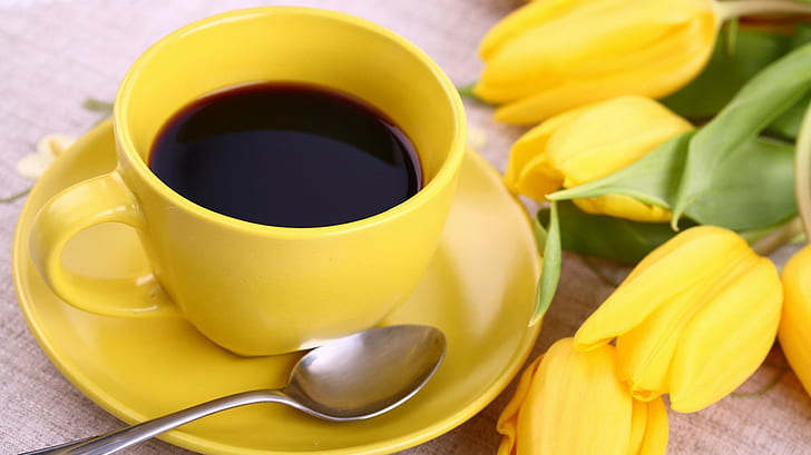 Breakfast, coffee, tulips, white ceramic mug with saucer and teaspoon