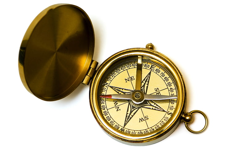 round gold-colored compass, direction, north, discovery, exploration