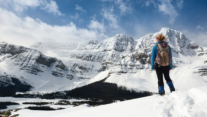 woman standing on snowfield, blonde, mountains, winter, cold temperature
