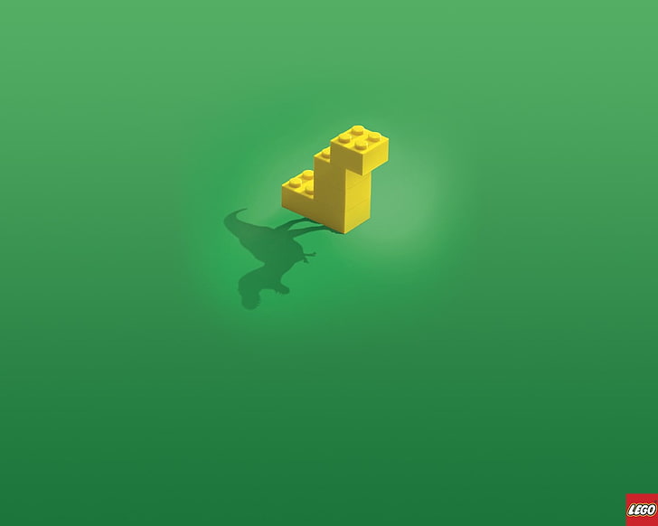 yellow LEGO brick toy, green background, dinosaurs, imagination