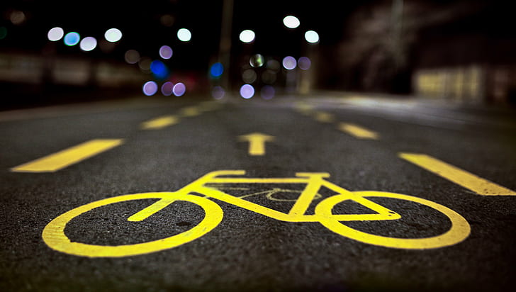 selective focus photography of bike lane signage, Dark Riders