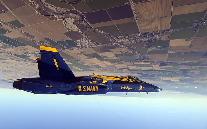 Fighter flying in the sky, flip flight, blue-and-yellow u.s navy jet fighter