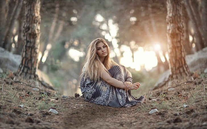 Girl sitting on the ground, forest, sunrise, woman in grey floral dress