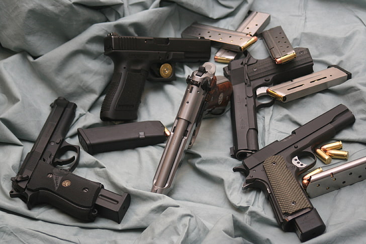 five black and gray semi-automatic pistols, weapons, guns, clips