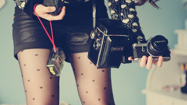 black and gray bridge camera and case, legs, shorts, stockings