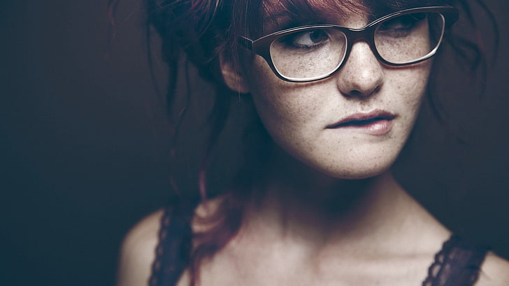 women's black framed eyeglasses, model, redhead, freckles, closeup