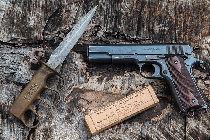 black semi-automatic pistol and brass-colored tactical knife