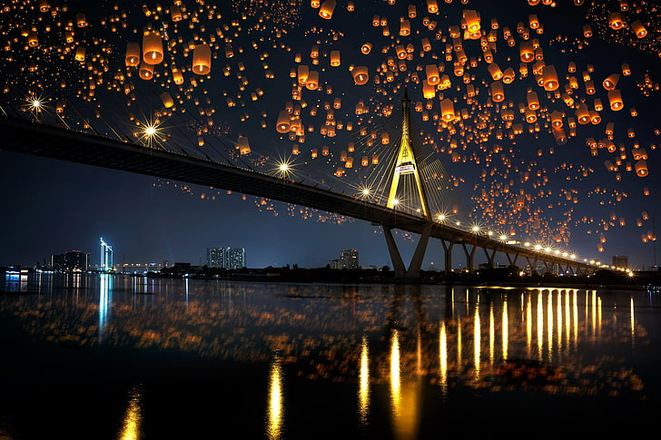landscape photo of black bridge, night, sky lanterns, reflection