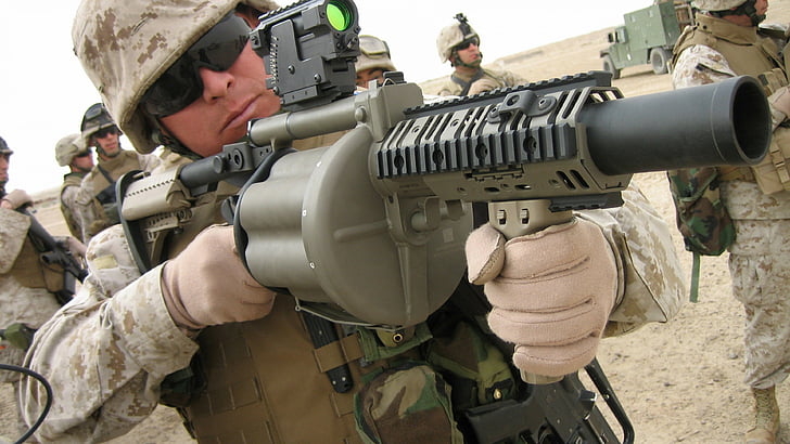 soldier holding grenade launcher during daytime, Milkor SuperSix MRGL